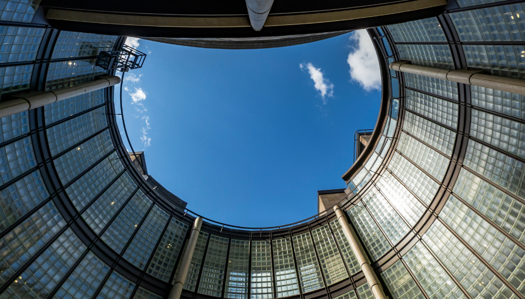 View from inside a circular court yerd at the centre of a high rise commercial building.