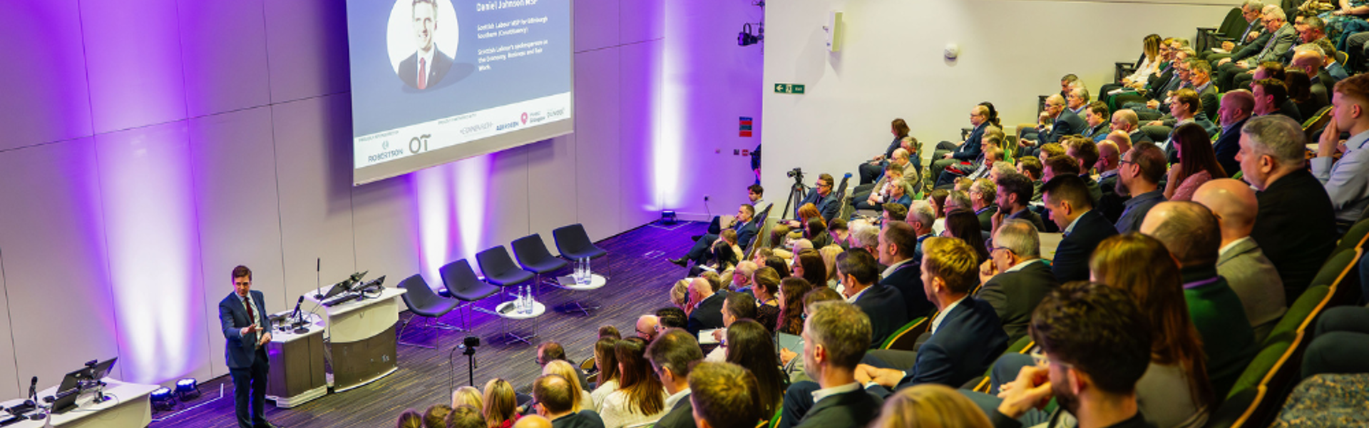 People sitting in terraced seats at a BPF Group Annual Conference